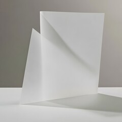Naklejka premium Folded sheet of translucent vellum paper with geometric shadow