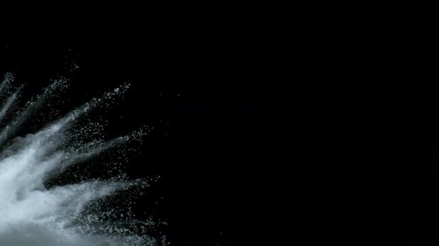 Super Slow Motion Shot of White Powder Blow Isolated on Black Background at 1000fps.