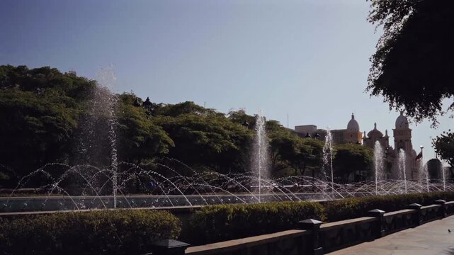 Water fountains spraying in a park near Chiquinquira Basilica in Maracaibo, Venezuela