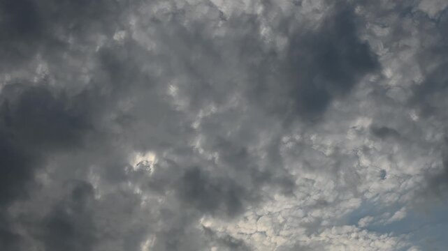 Mid-day timelapse of multi layered clouds drifting trough a summer blue sky