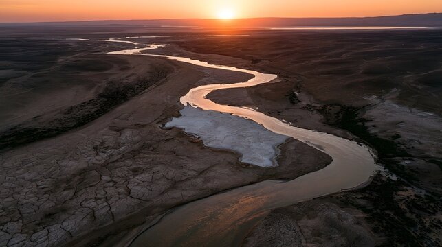 Winding Desert River at Sunset with Salt Flat