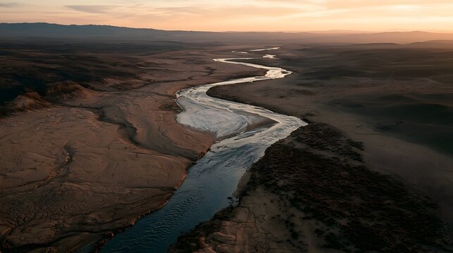 Winding Desert River at Sunset with Salt Flat