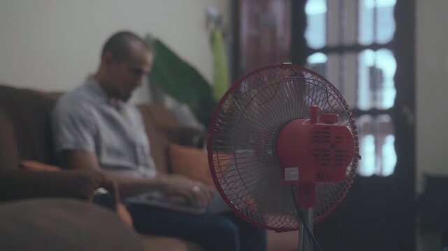 Electric floor fan cooling while working