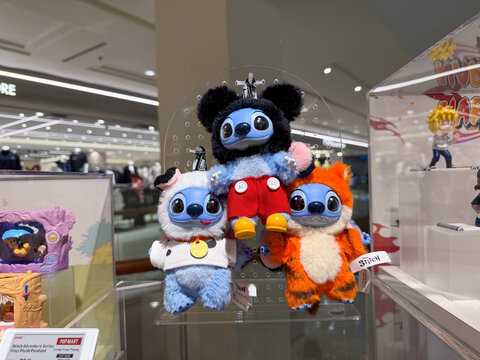 PENANG, MALAYSIA - JUL 21, 2026: Disney Stitch plush toys displayed for sale at a Pop Mart retail store.