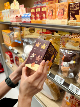 PENANG, MALAYSIA - JUL 03, 2026: Hand holding Pop Mart Twinkle Twinkle Moon Gelato blind box inside retail toy store.