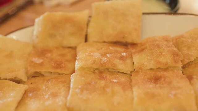 Close Up of Fried Roti Pancake with Egg on a Plate