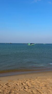 Landscape a traditional fishing village in Rachvem Bay on Phu Quoc Island, Vietnam. Boat in sea. Traditional fishing boats are moored to rickety wooden in local fishing villages. Sea beach is by calm 