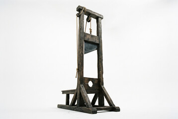 Naklejka premium Antique wooden guillotine on white background
