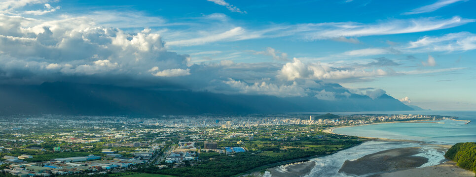 Aerial view of Hualien city, highlighting urban growth and beautiful mountains and clouds