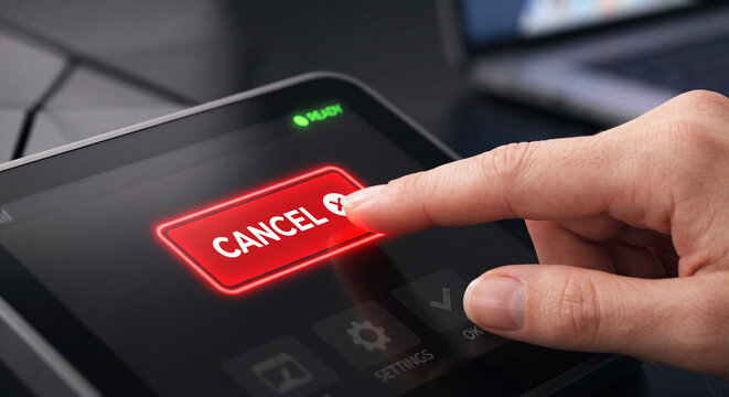 Close up of finger pressing red glowing CANCEL button on digital touch screen interface
