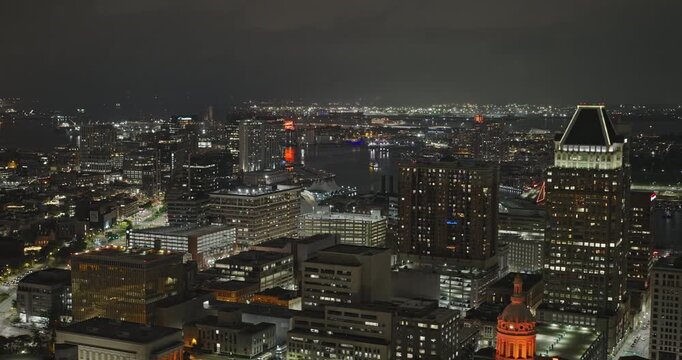 Baltimore Maryland Aerial v66 night flyover above Mount Vernon and Seton Hill, revealing downtown towers and harbor lights - Shot with 8k ProRes Camera - Sept 28th 2023