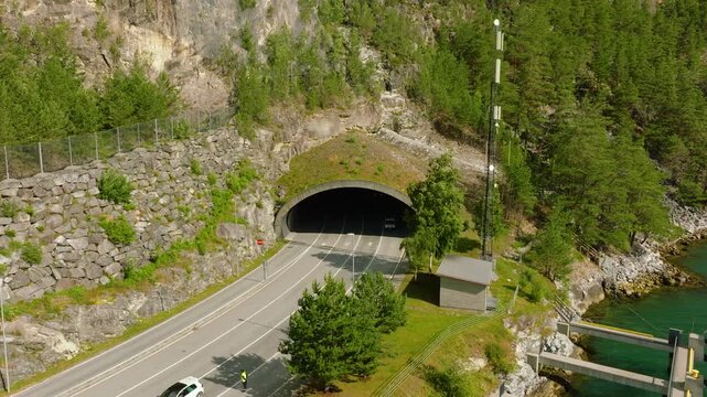 Aerial drone footage of the entrance to Amlatunnelen near Mannheller in Sogndal, Norway. The road tunnel on National Road 5 leads directly toward the Mannheller&ndash;Fodnes ferry connection 