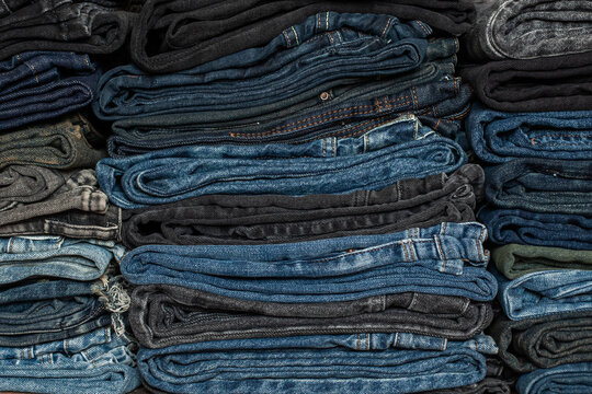  Various jeans folded into a stack
