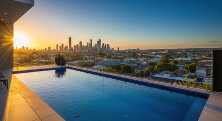 Fototapeta premium Luxury Rooftop Infinity Pool Overlooking City Skyline At Sunset