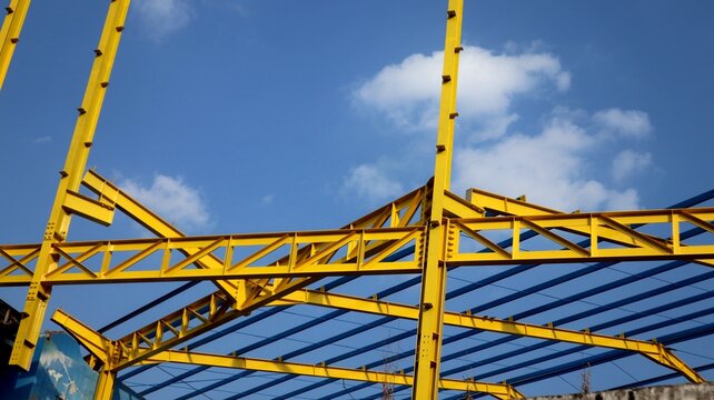 The yellow steel construction frame of the building