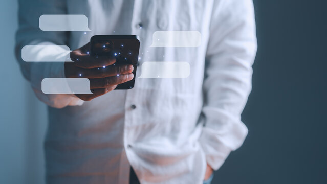 Adult man using smartphone for digital communication. Blank chat bubbles and network nodes represent modern internet technology, virtual social messaging app and global business.