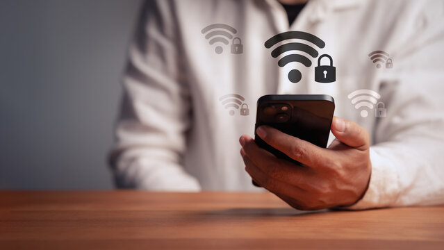 Man using smartphone for safe internet connection. Secure wifi network, cybersecurity, mobile technology, and digital privacy concept for business data protection and security.