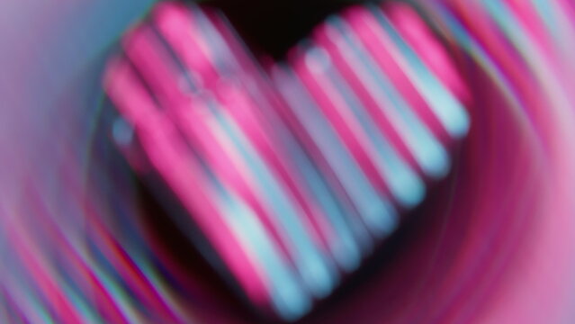 Twinkle love. Blur flare romantic. Defocused purple blue neon color heart sparkle lens flare glare flicker gleam on abstract dark black background.
