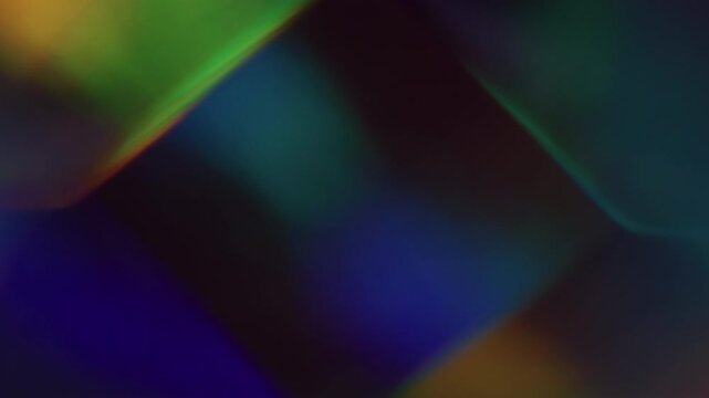 Blur illuminated. Geometric glow. Defocused green yellow red multicolor shine lens flare glare flicker gleam on abstract neon background.