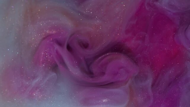Shimmer ink smoke. Shiny mist. Blur blue purple orange color glitter paint splash texture cloud water spreading on abstract background.