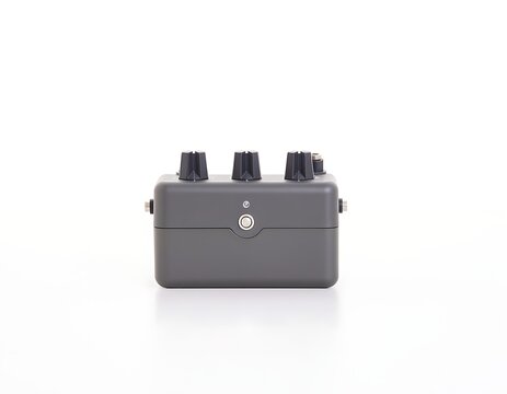 Close-up view of a gray metal electrical junction box with threaded ports.