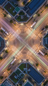 Aerial night view of complex smart city intersection with nodes
