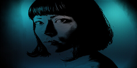 Portrait of young woman with short hair styled in mysterious blue moody lighting mood.