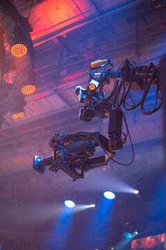  Professional TV broadcast camera on crane at live concert stage with copy space