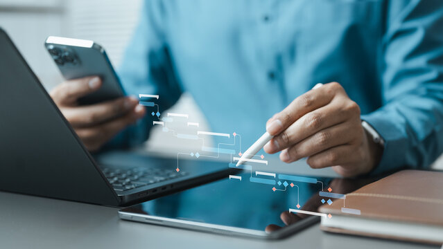 Professional planning a digital Gantt chart across tablet, laptop and smartphone, illustrating project scheduling, workflow management and team collaboration.