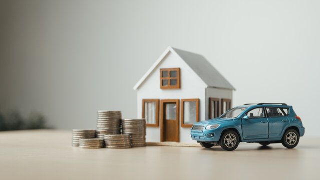 Personal assets including a home, car and savings represent financial planning, insurance protection and long-term wealth management.
