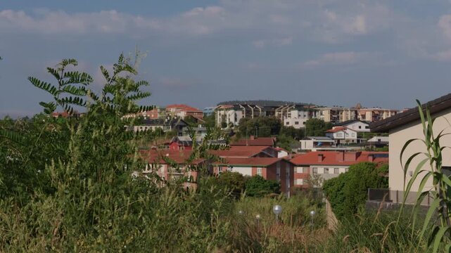 Residential buildings nestled on a hillside overlooking the coastal landscape of Sopelana Algorta, Basque Country, Spain