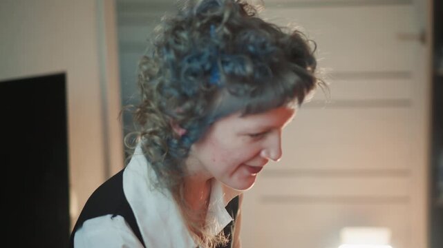 Soft lit study foresight session, thoughtful. Woman reviews notes with quiet focus, ambient lamp glow, profile closeup, introspective mood, planning future choices and gentle revelation.
