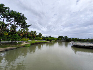Fototapeta premium Scenic Park Pond with Lush Greenery