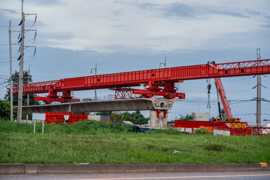 A structures at a construction site for a new concrete road and bridge, with steel beams and cranes at work a crucial infrastructure project for a major city.