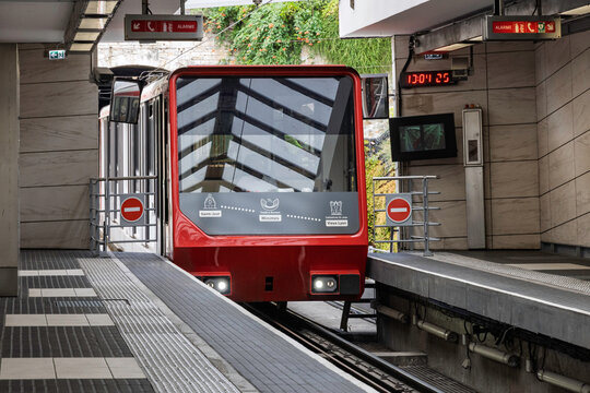 Lyon, France - July 27, 2026: Modern red funicular train stopped at station platform on Saint-Just line in Lyon city public transportation system.