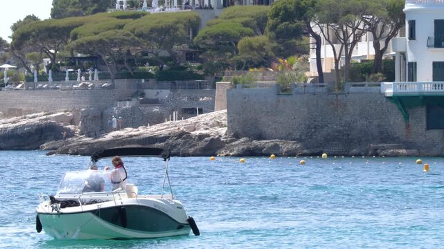Motorboat Cruising Along the Scenic Coastline of Cassis France