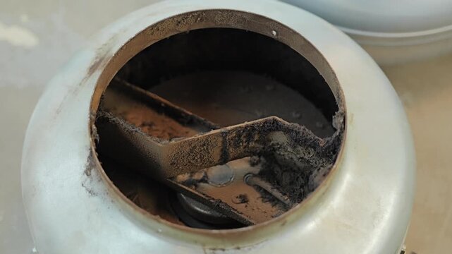Heavy dust accumulation inside duct fan, neglected HVAC maintenance needs