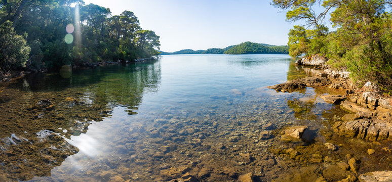 View of Veliko Jezero or Big Lake in Mljet National Park on Mljet Island in Croatia. Protected Mediterranean nature and peaceful lake landscape concept.