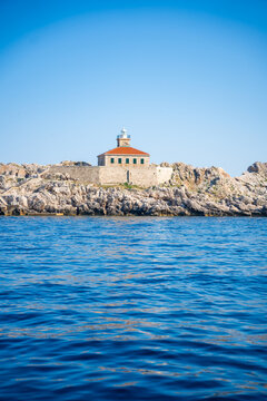 Grebeni Lighthouse on the Grebeni Islets near Dubrovnik in Croatia on the Adriatic Sea. Historic maritime navigation landmark guiding vessels along the Dalmatian coast.
