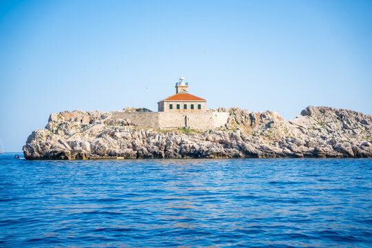 Grebeni Lighthouse on the Grebeni Islets near Dubrovnik in Croatia on the Adriatic Sea. Historic maritime navigation landmark guiding vessels along the Dalmatian coast.