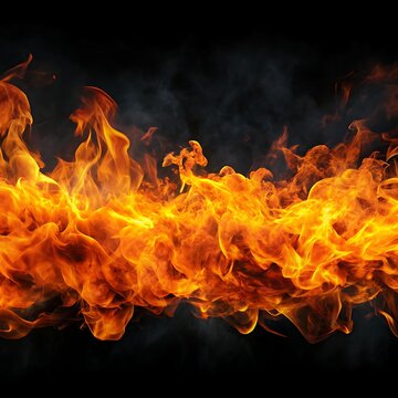 Intense bright orange fire flames burning with smoke against a dark background blaze