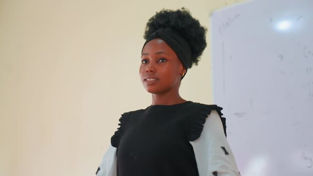 Black child delivering confident classroom speech with clear gestures near whiteboard, poised posture and steady gaze, strong diction and storytelling energy, mentorship and training vibe