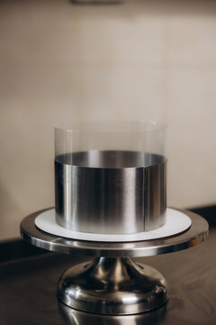 Round cake ring with acetate film on stand