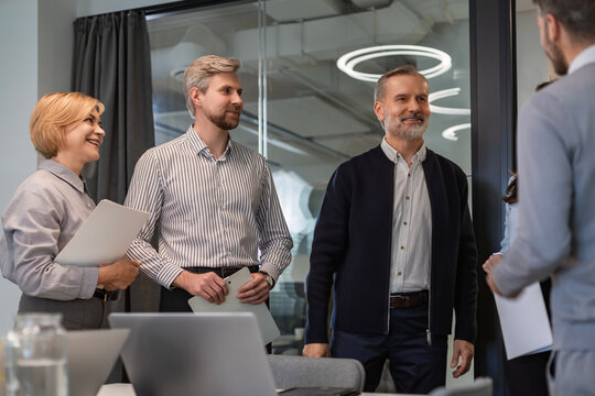 Business meeting - manager discussing work with his colleagues.