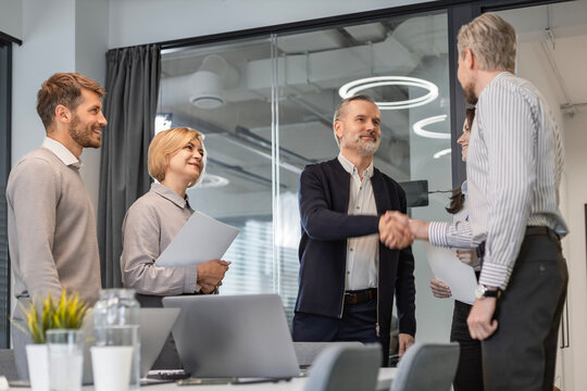 Business people shaking hands, finishing up a meeting