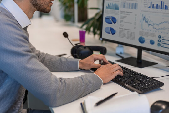Businessman professional hands typing on a keyboard. Working on financial documents. Auditing