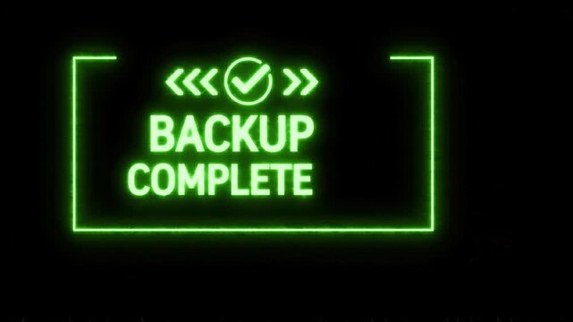 Green Backup Complete Text Animation with Glitch Effect on Black