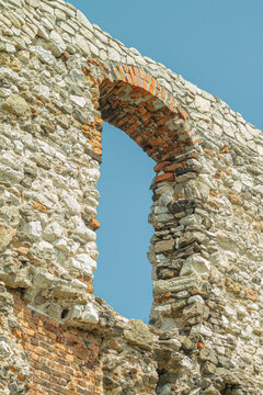 Arched window opening in old stone castle wall real detailed photography