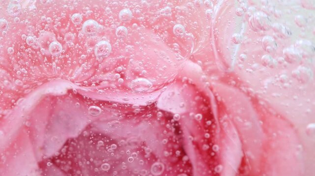 Pink serum gel background, cream, shampoo, macro soap bubbles, foam texture