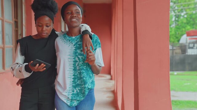 Casual walk through colorful hallway together. Enjoying leisurely stroll with child in pink corridor. Mother and offspring share joyful moments during relaxed walk amidst cheerful surroundings